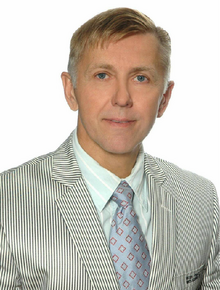 A portrait of Raimundas Čiegis, an expert real estate broker.